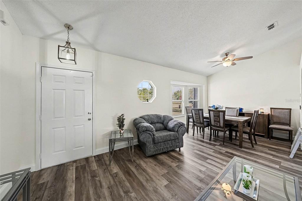 3267 Guava Lane Spring Hill, FL 34609 - Photo 5 of 30 a living room with furniture and a table