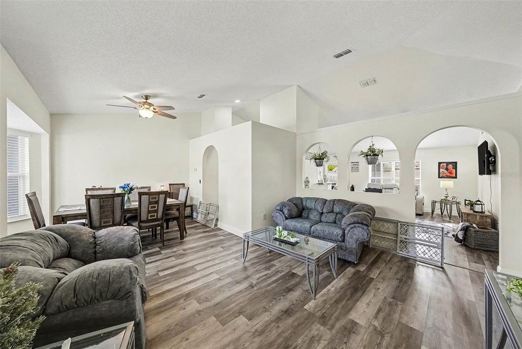 3267 Guava Lane Spring Hill, FL 34609 - Photo 6 of 30 a living room with furniture and a chandelier