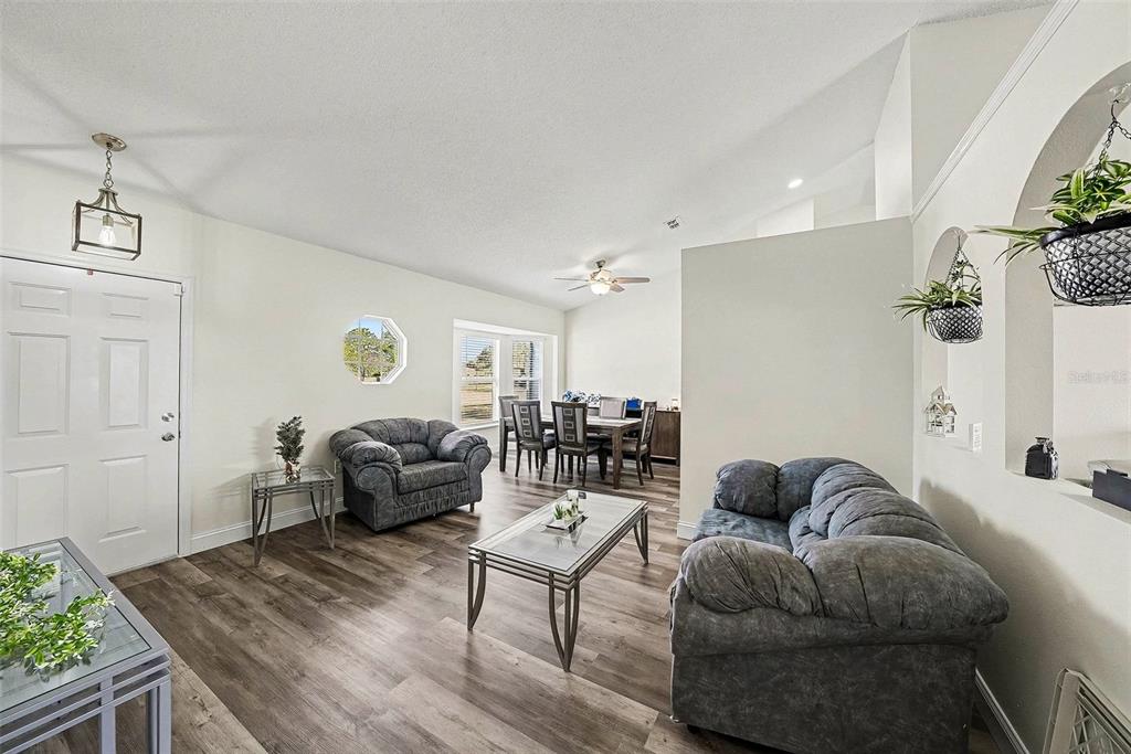 3267 Guava Lane Spring Hill, FL 34609 - Photo 7 of 30 a living room with furniture and a table