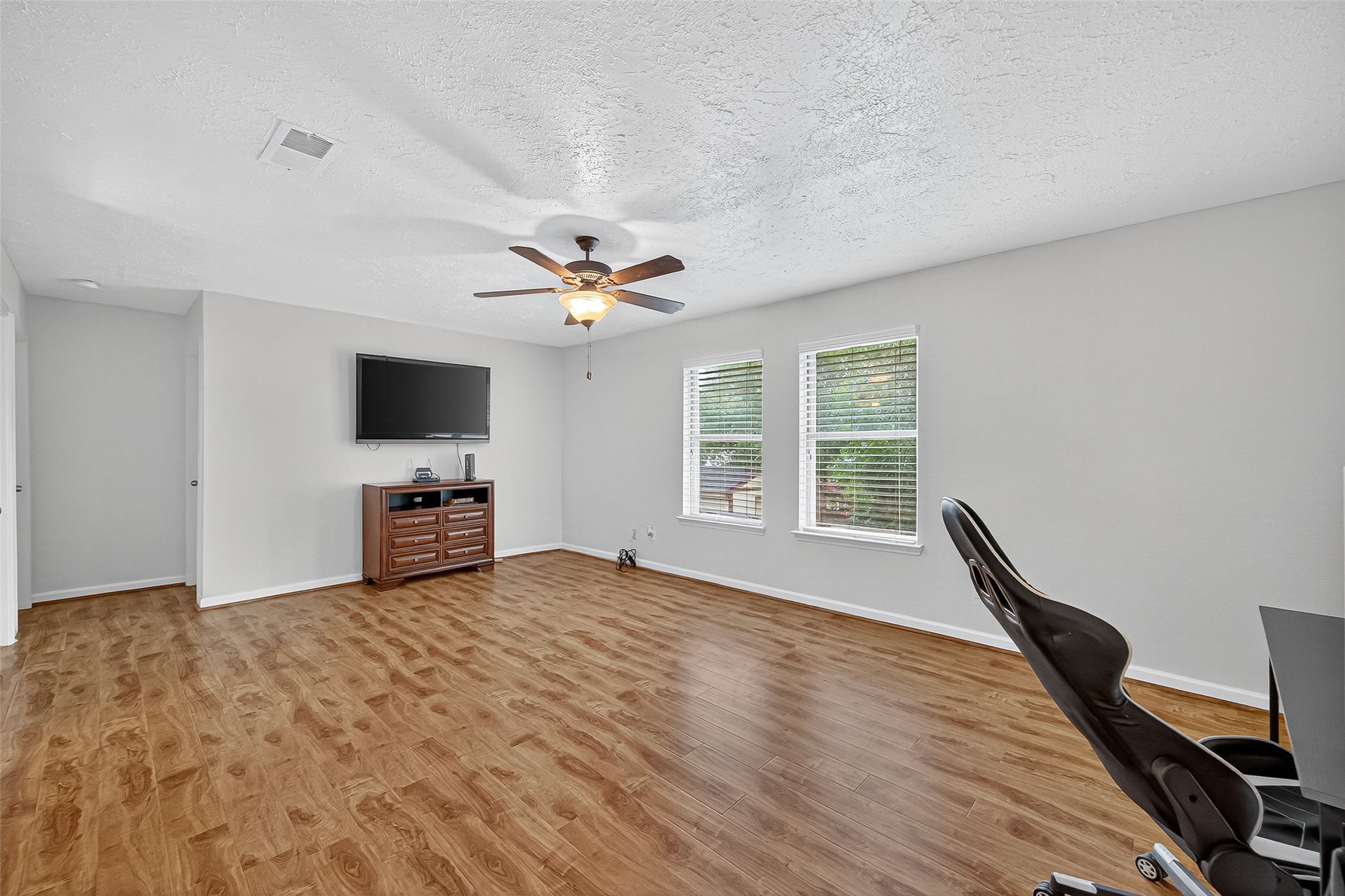 5323 Windsong Trail Houston, TX 77084 - Photo 20 of 30 Gorgeous LVP flooring and fresh paint, this game room is ready for fun nights and making memories!