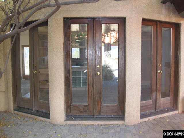a bathroom with a glass shower door
