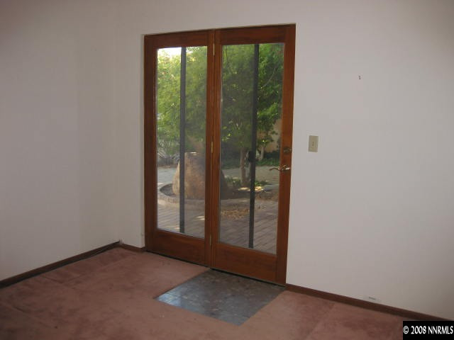 3355 Bacon Rind Road Reno, NV 89510 - Photo 4 of 9 a view of an empty room with sliding glass door