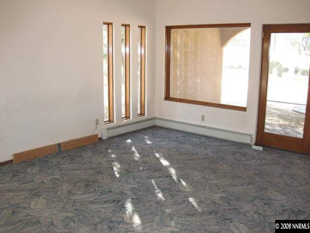 3355 Bacon Rind Road Reno, NV 89510 - Photo 7 of 9 an empty room with windows and closet