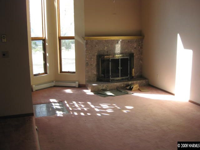 3355 Bacon Rind Road Reno, NV 89510 - Photo 8 of 9 a view of a livingroom with a fireplace