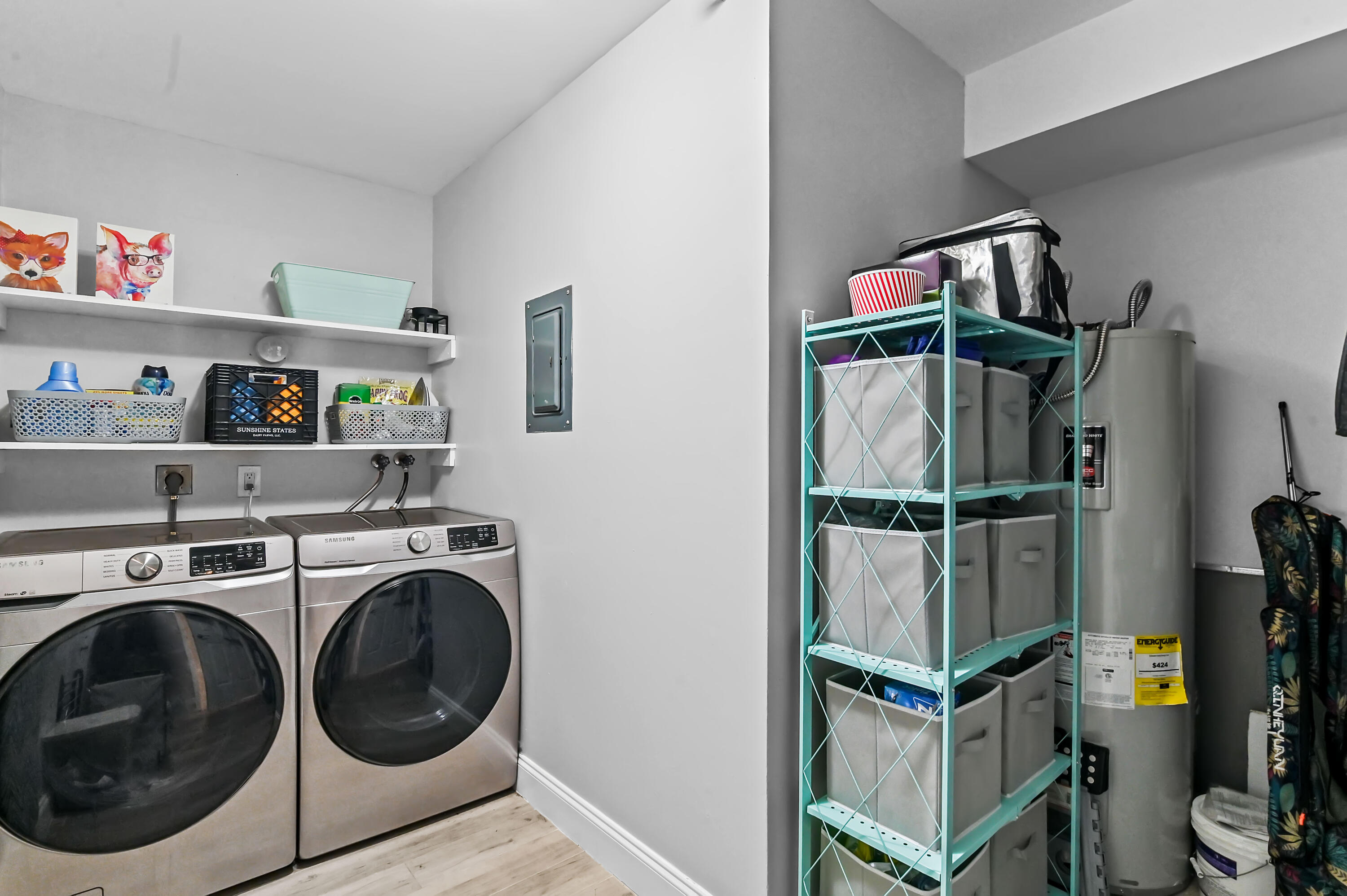 6400 Northwest 2nd Avenue, Unit 124 Boca Raton, FL 33487 - Photo 14 of 33 a view of a storage & utility room with washer and dryer