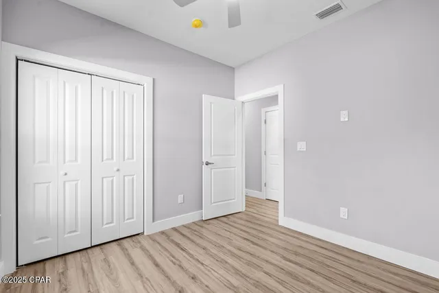 a view of a livingroom with wooden floor