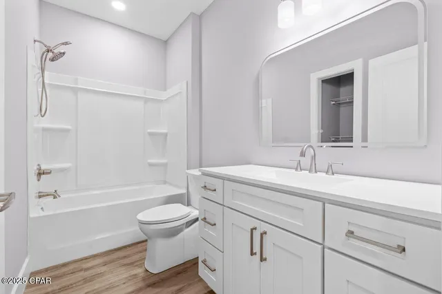 a bathroom with a sink a toilet and a bathtub