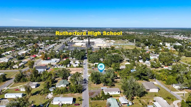 an aerial view of residential houses with outdoor space