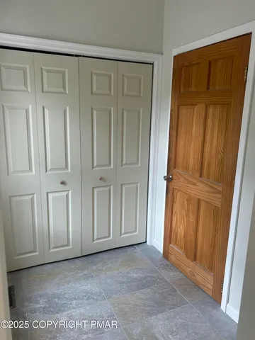 an empty room with wooden door