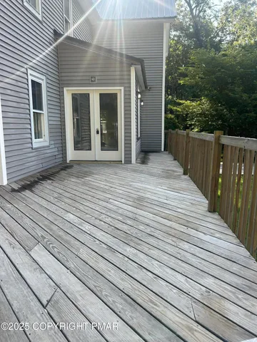 a view of backyard with small cabin