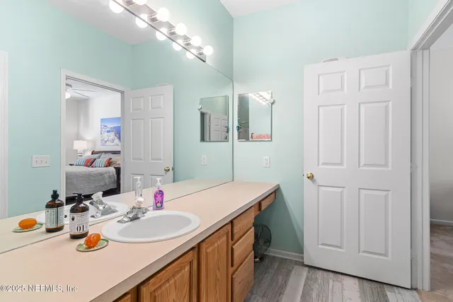 a bathroom with a sink and a mirror