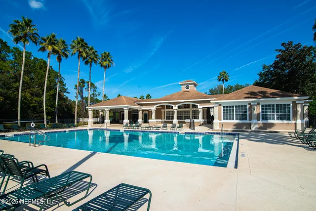 a front view of a house with a yard table and chairs