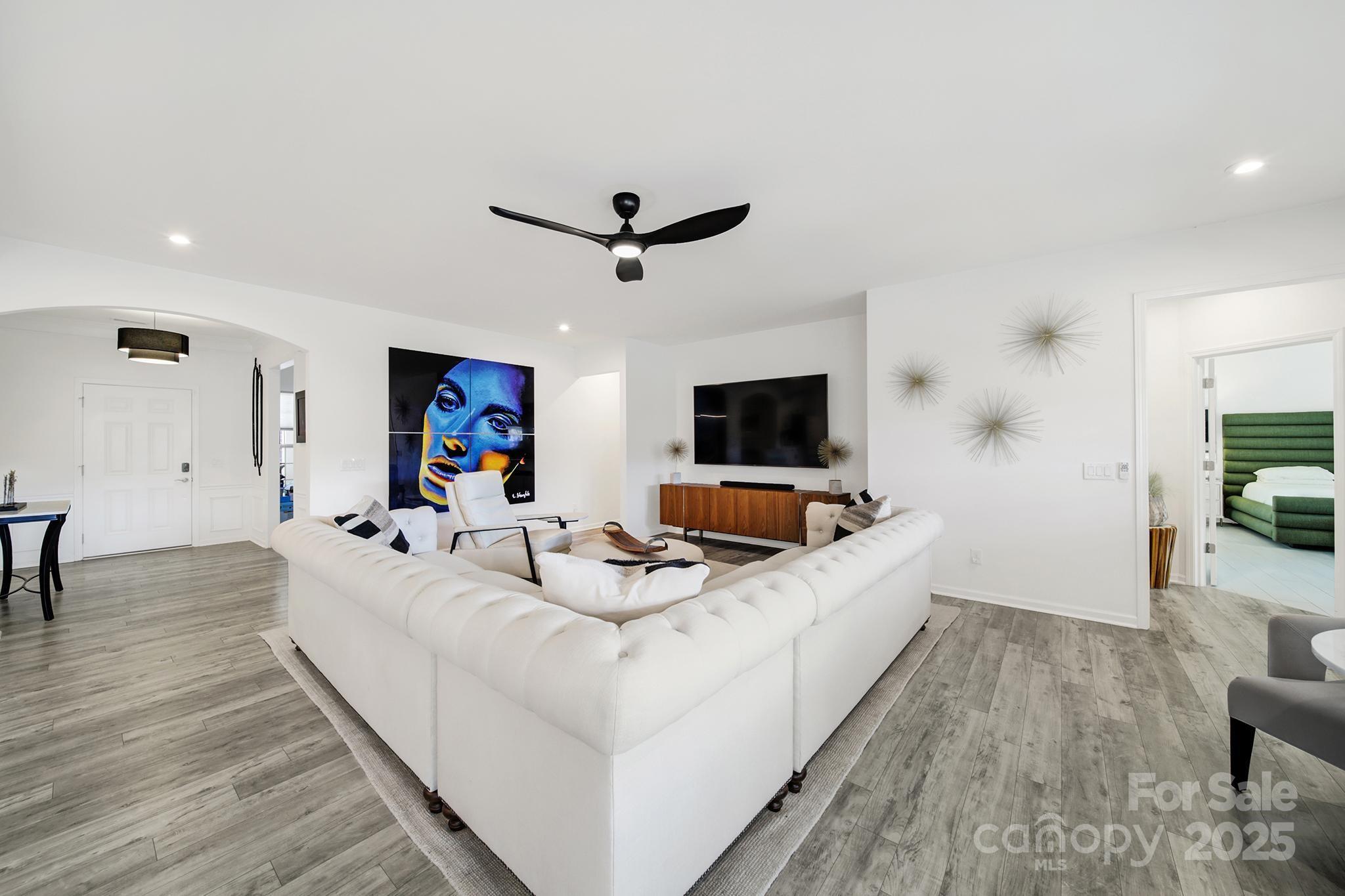 3135 Bartlett Street Fort Mill, SC 29715 - Photo 12 of 43 a living room with furniture and a flat screen tv
