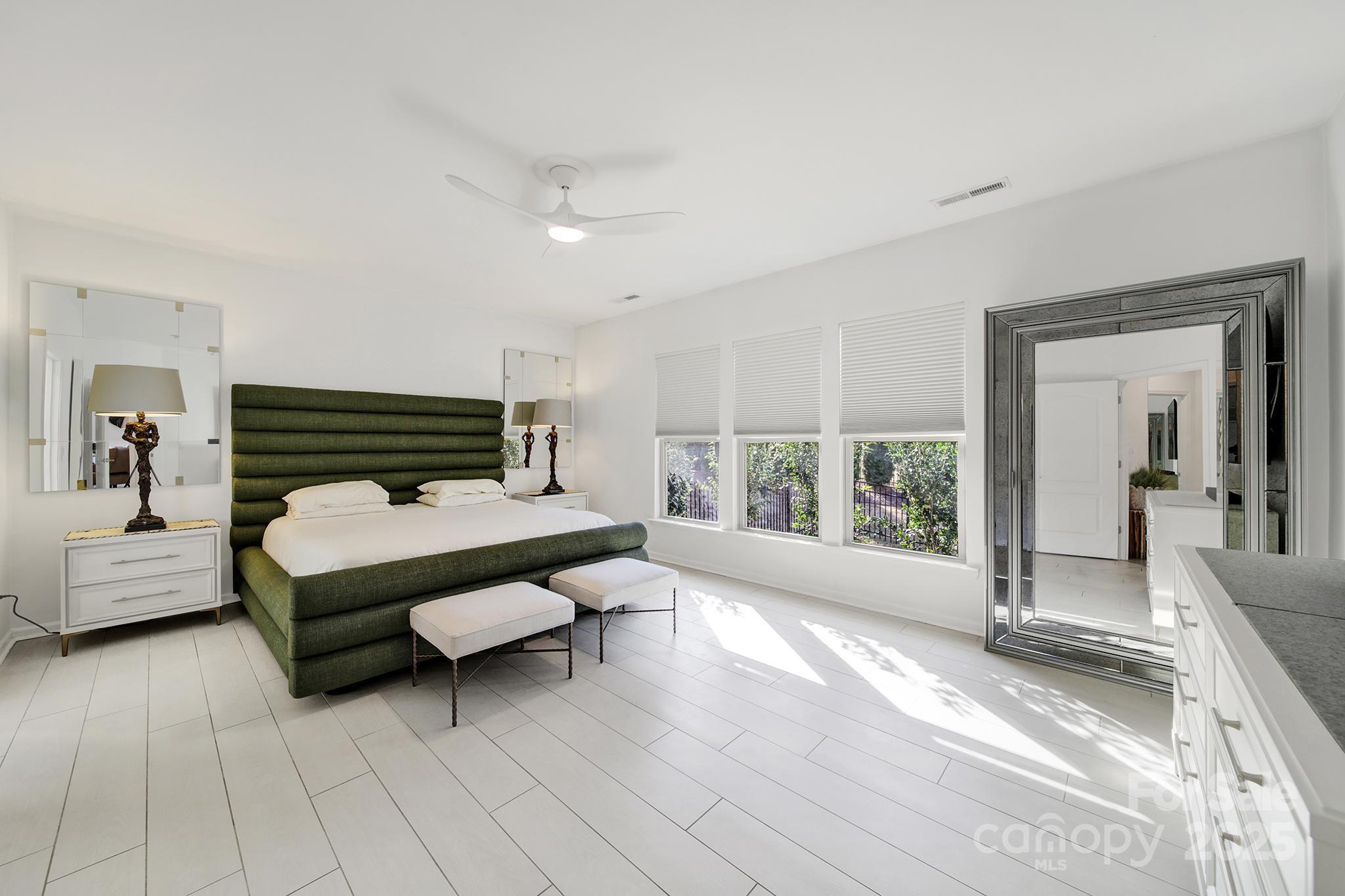3135 Bartlett Street Fort Mill, SC 29715 - Photo 14 of 43 a bedroom with furniture and large windows