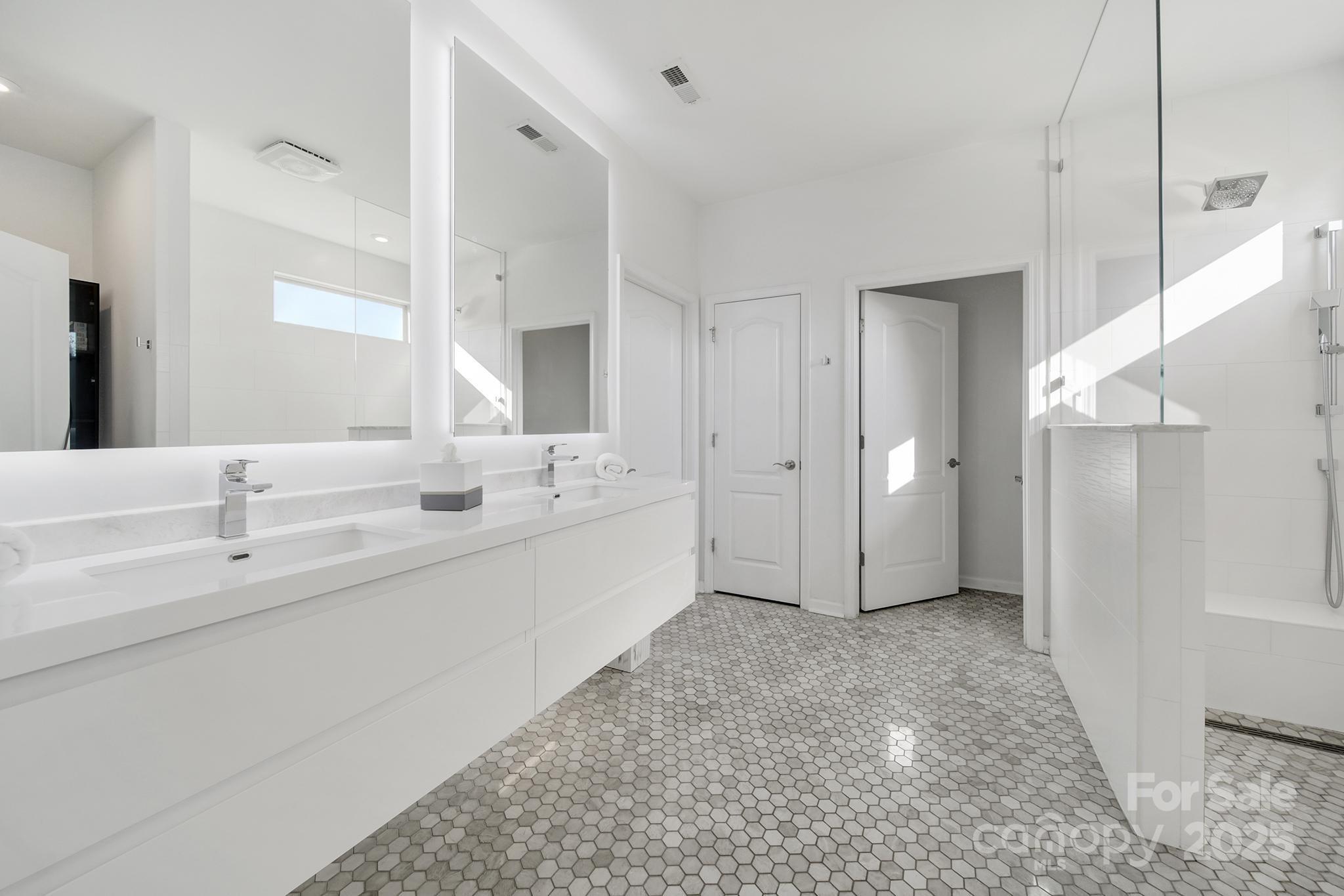3135 Bartlett Street Fort Mill, SC 29715 - Photo 15 of 43 a bathroom with a double vanity sink mirror and shower