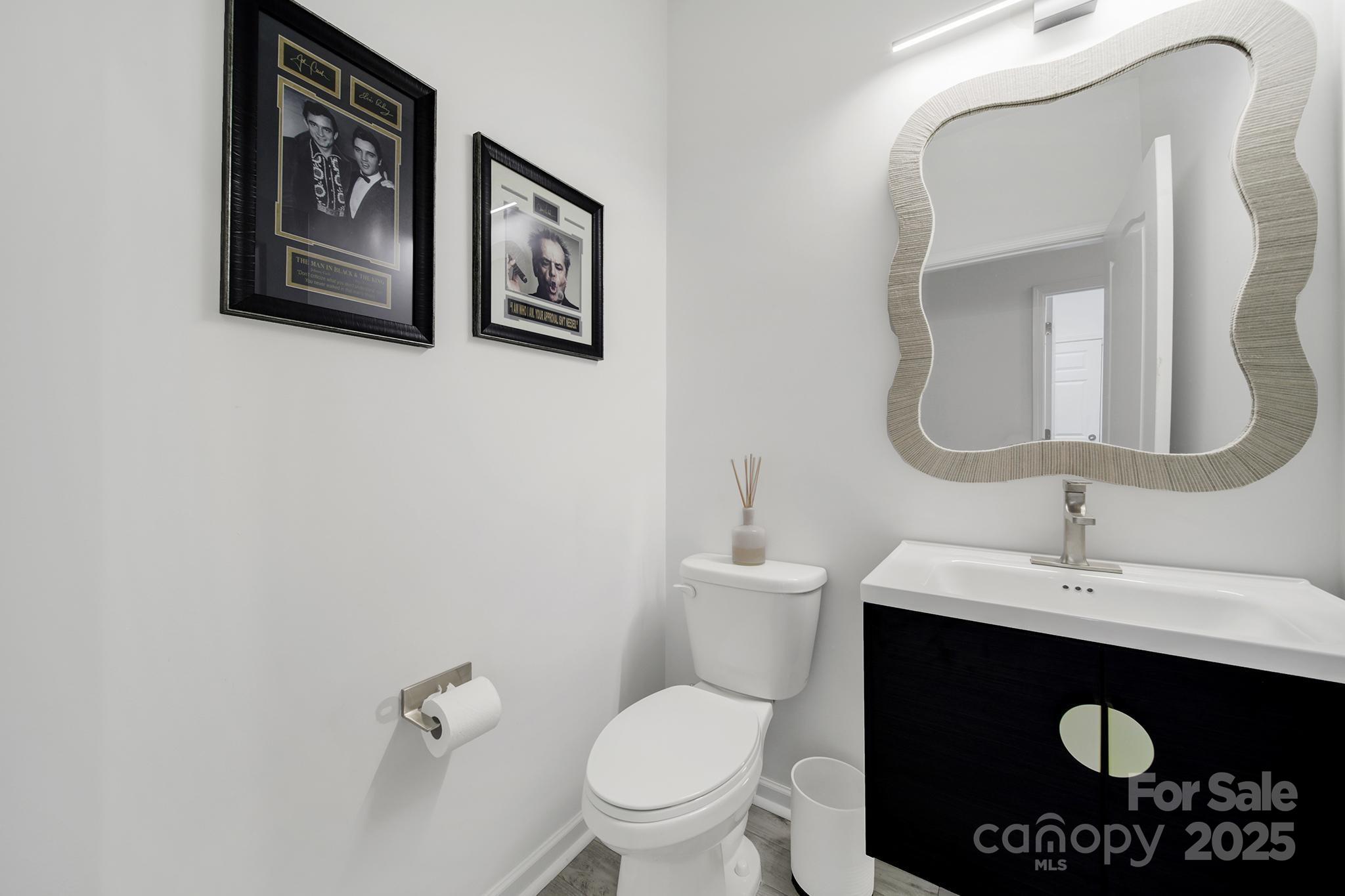 3135 Bartlett Street Fort Mill, SC 29715 - Photo 21 of 43 a bathroom with a toilet sink and mirror