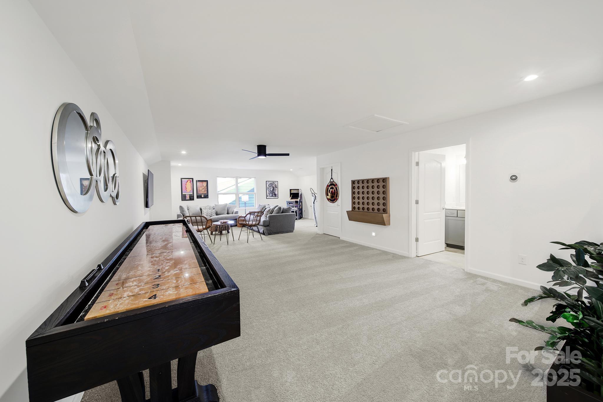 3135 Bartlett Street Fort Mill, SC 29715 - Photo 23 of 43 a view of a livingroom with furniture and mirror