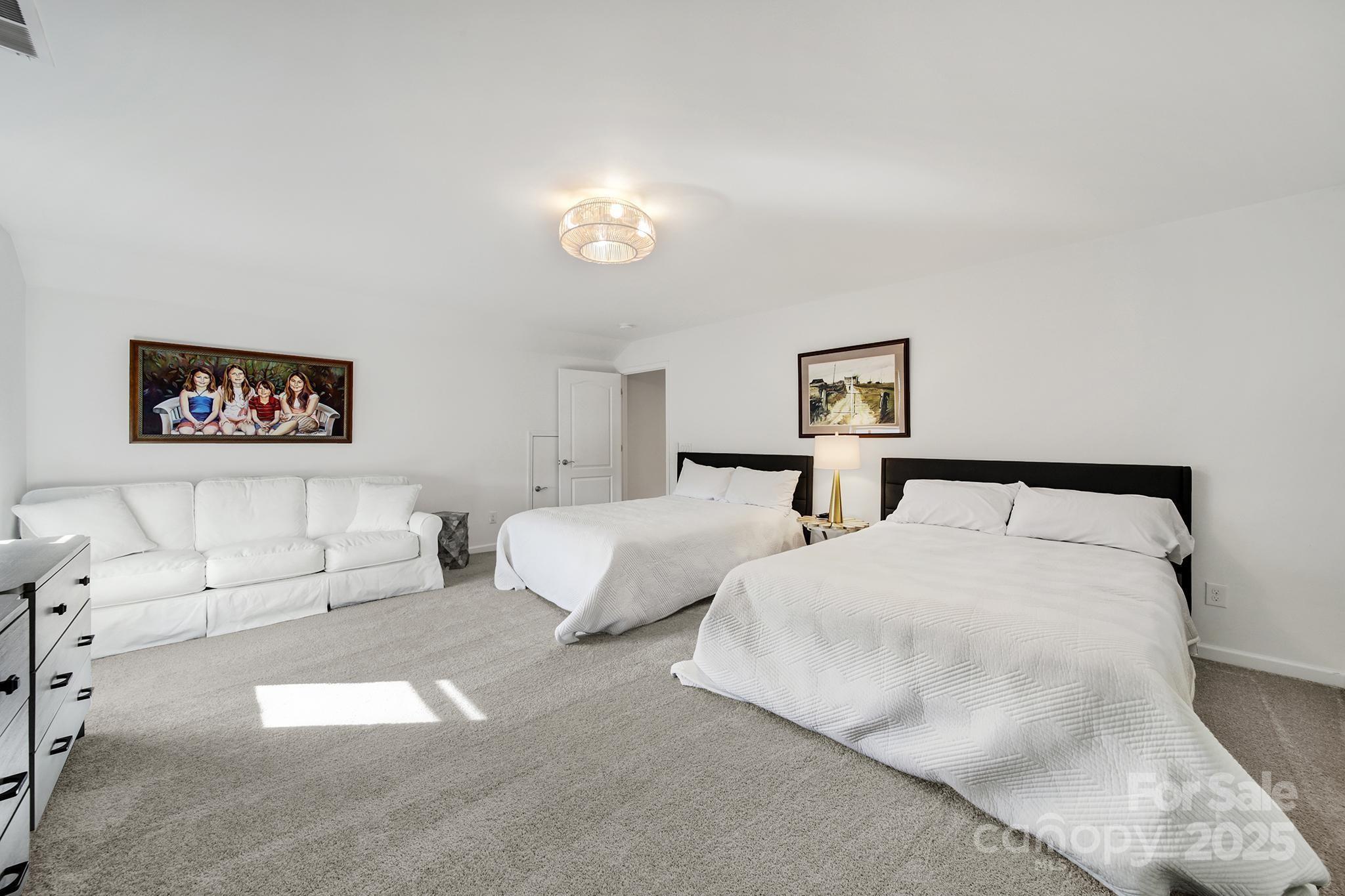 3135 Bartlett Street Fort Mill, SC 29715 - Photo 27 of 43 a bed room with two twin beds and a couch