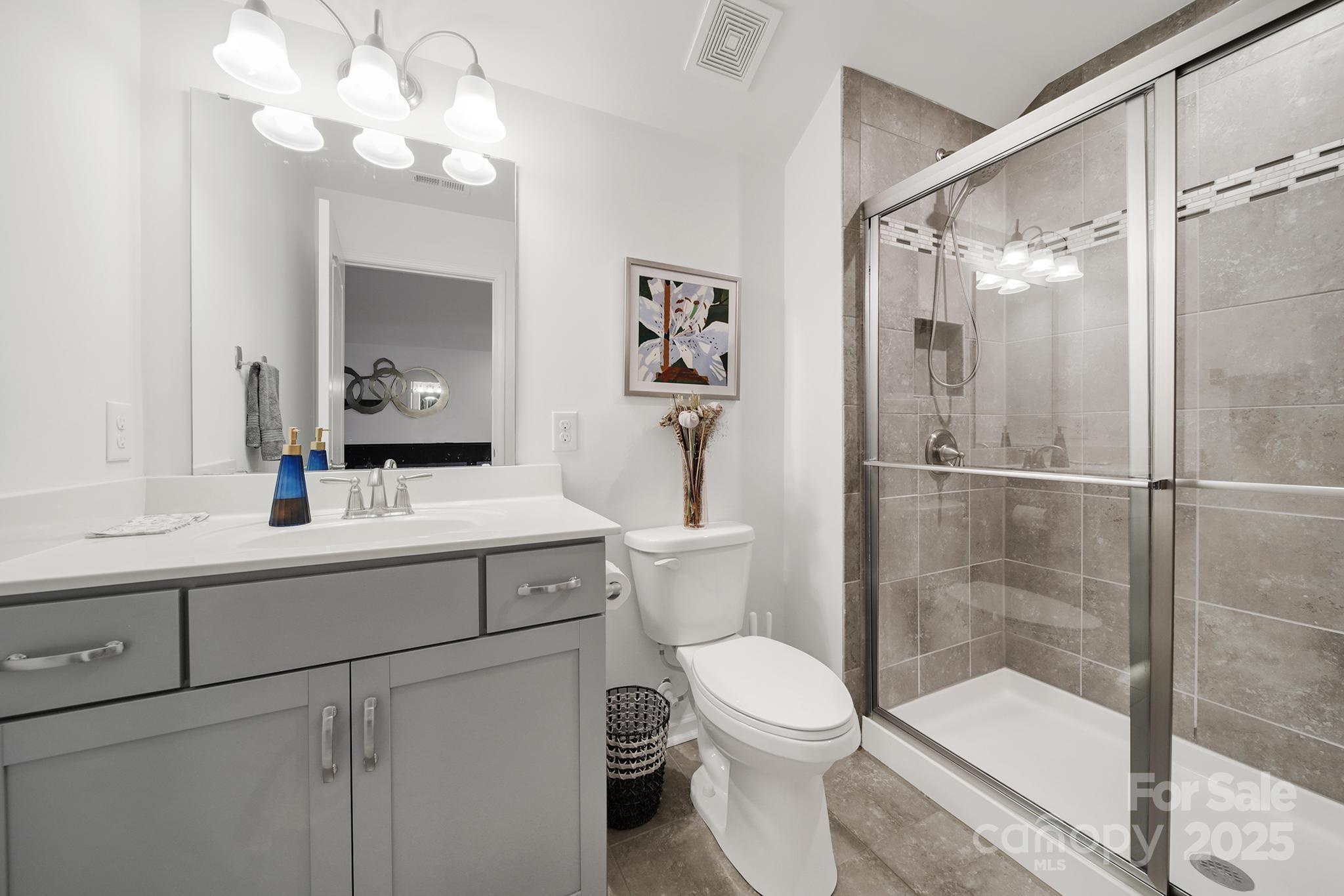 3135 Bartlett Street Fort Mill, SC 29715 - Photo 28 of 43 a bathroom with a sink a toilet and shower