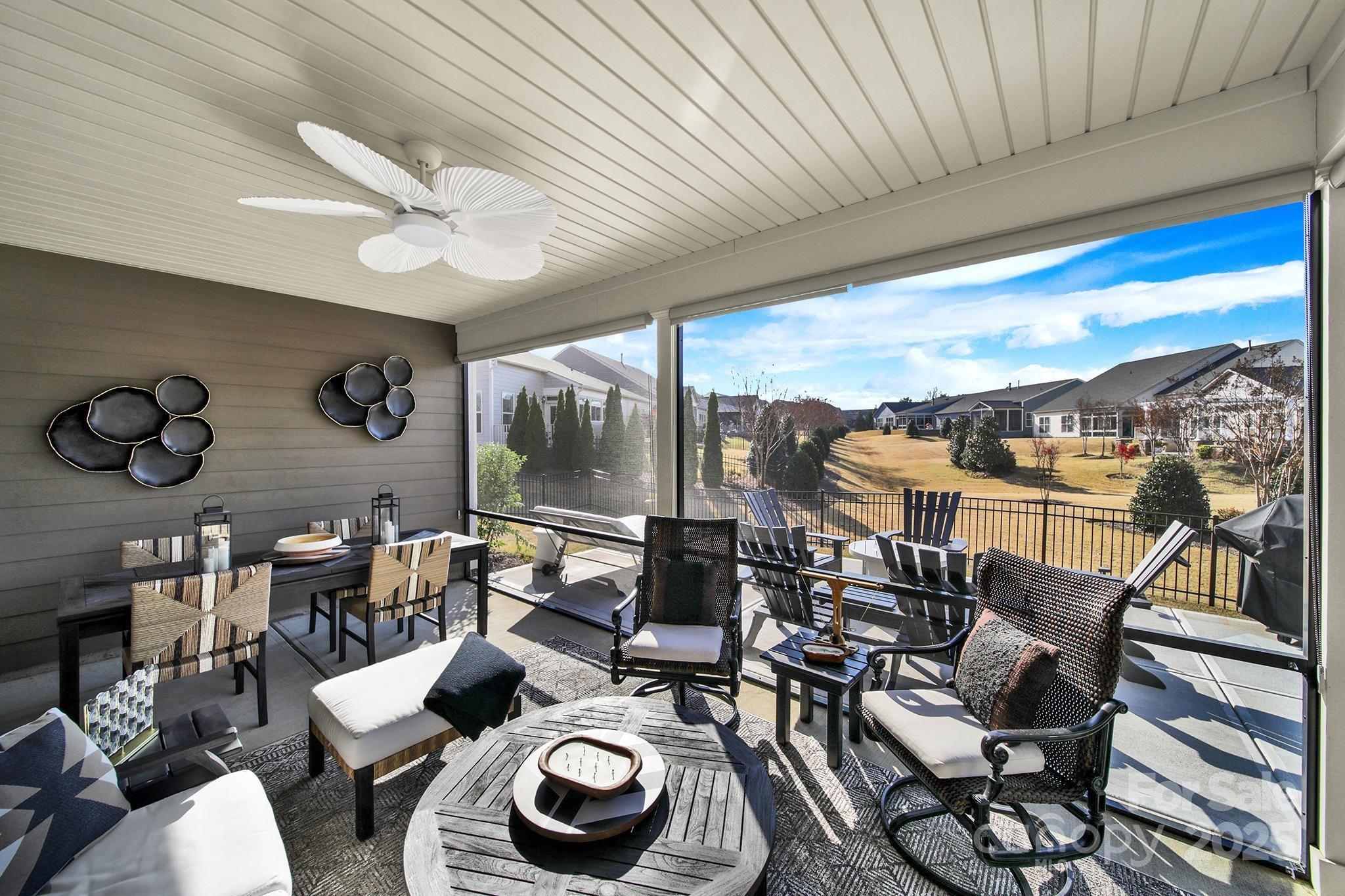 3135 Bartlett Street Fort Mill, SC 29715 - Photo 29 of 43 a living room with furniture and a floor to ceiling window