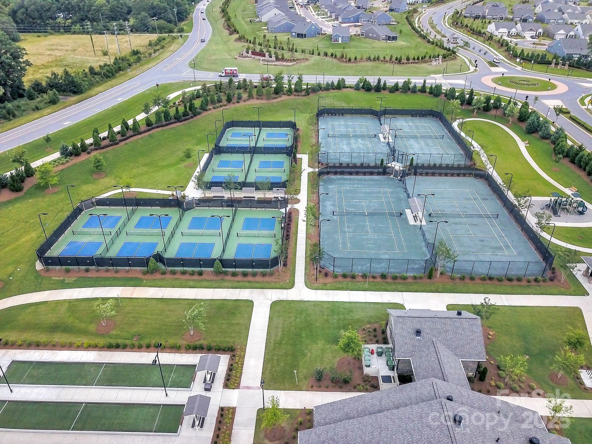 3135 Bartlett Street Fort Mill, SC 29715 - Photo 42 of 43 an aerial view of a house with a garden and lake view