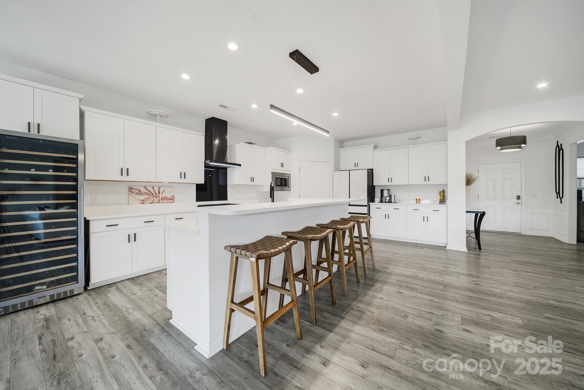 3135 Bartlett Street Fort Mill, SC 29715 - Photo 6 of 43 a kitchen with white cabinets and stainless steel appliances