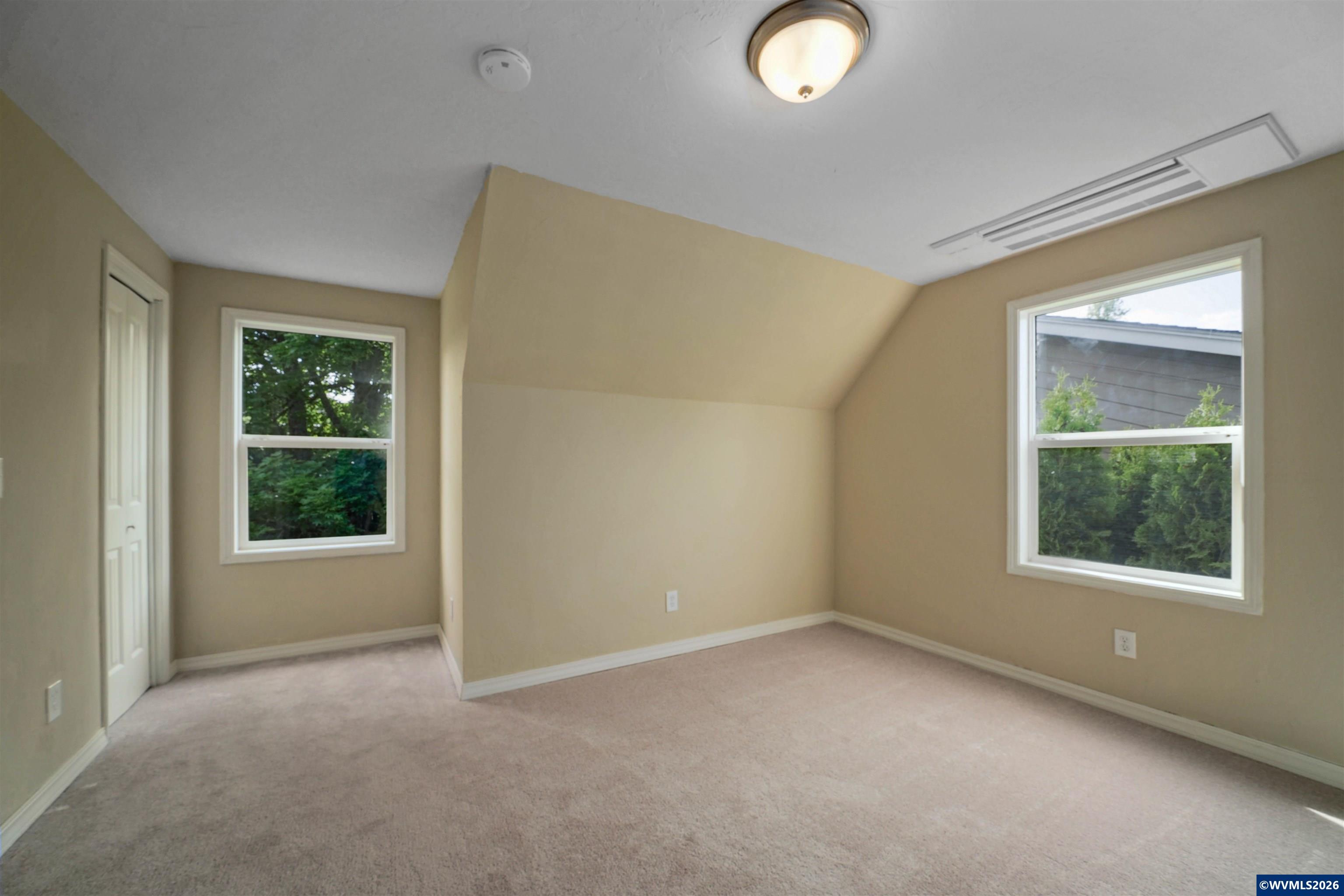 220 Northwest Downy Drive Sublimity, OR 97385 - Photo 30 of 47 an empty room with windows and closet
