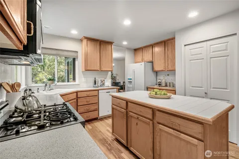 a kitchen that has a sink and a stove