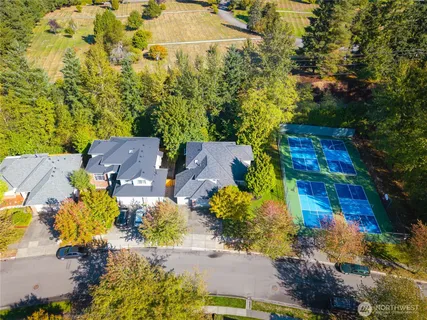 an aerial view of residential houses with outdoor space