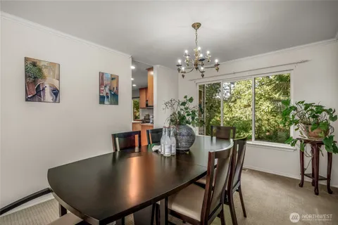 a view of a dining room with furniture window and outside view