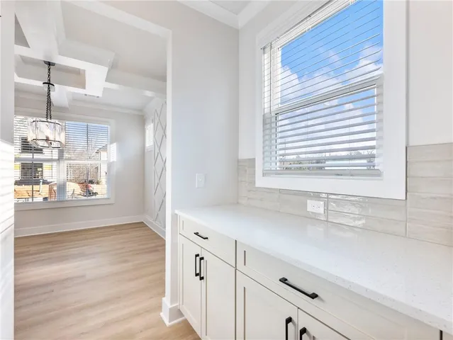 a bathroom with a sink and a window
