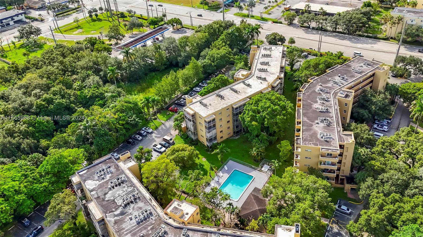 4111 Stirling Road, Unit 304 Fort Lauderdale, FL 33314 - Photo 15 of 22 an aerial view of a house with a garden and swimming pool