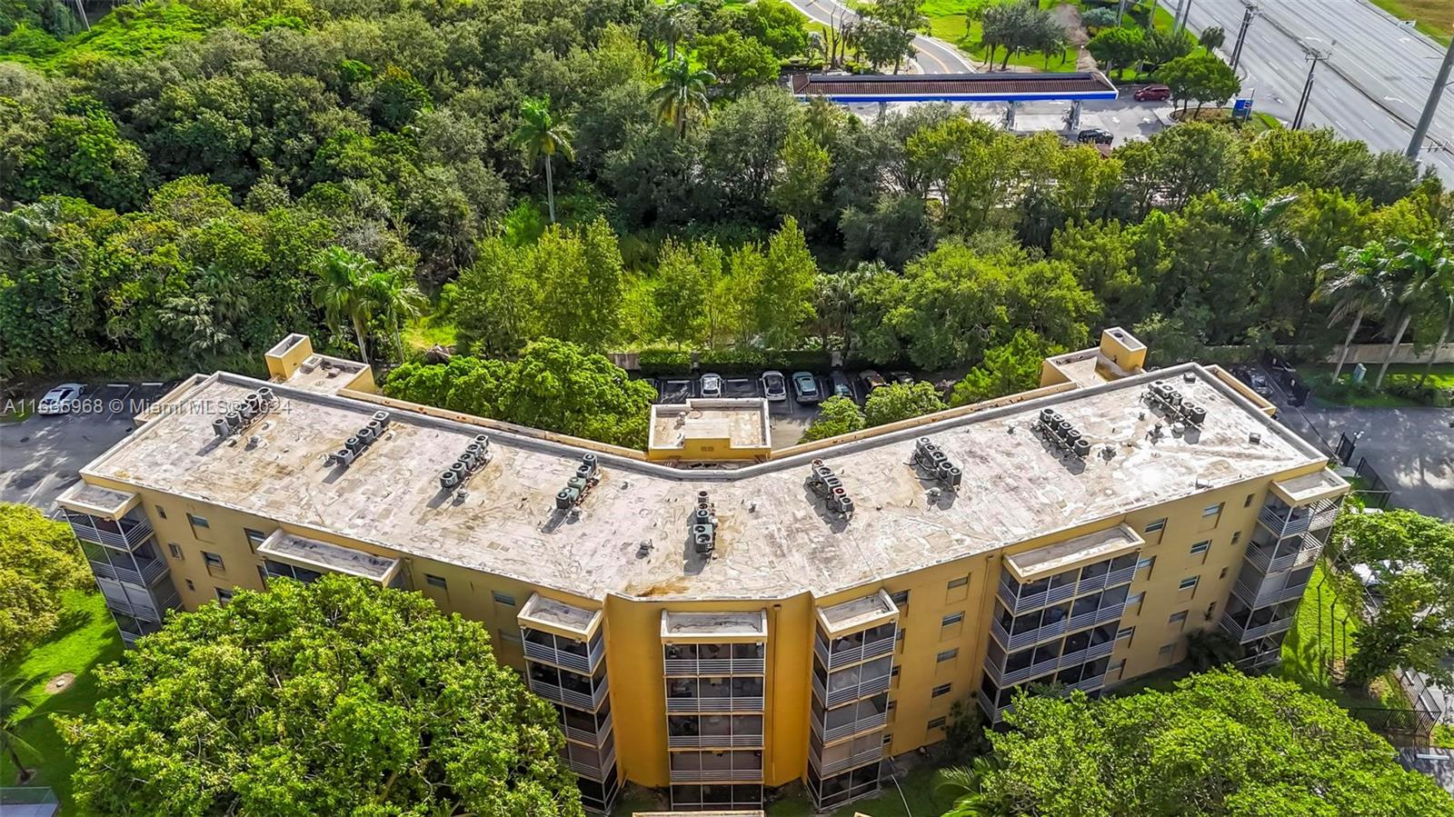 4111 Stirling Road, Unit 304 Fort Lauderdale, FL 33314 - Photo 17 of 22 a view of a large building with a tree in the background