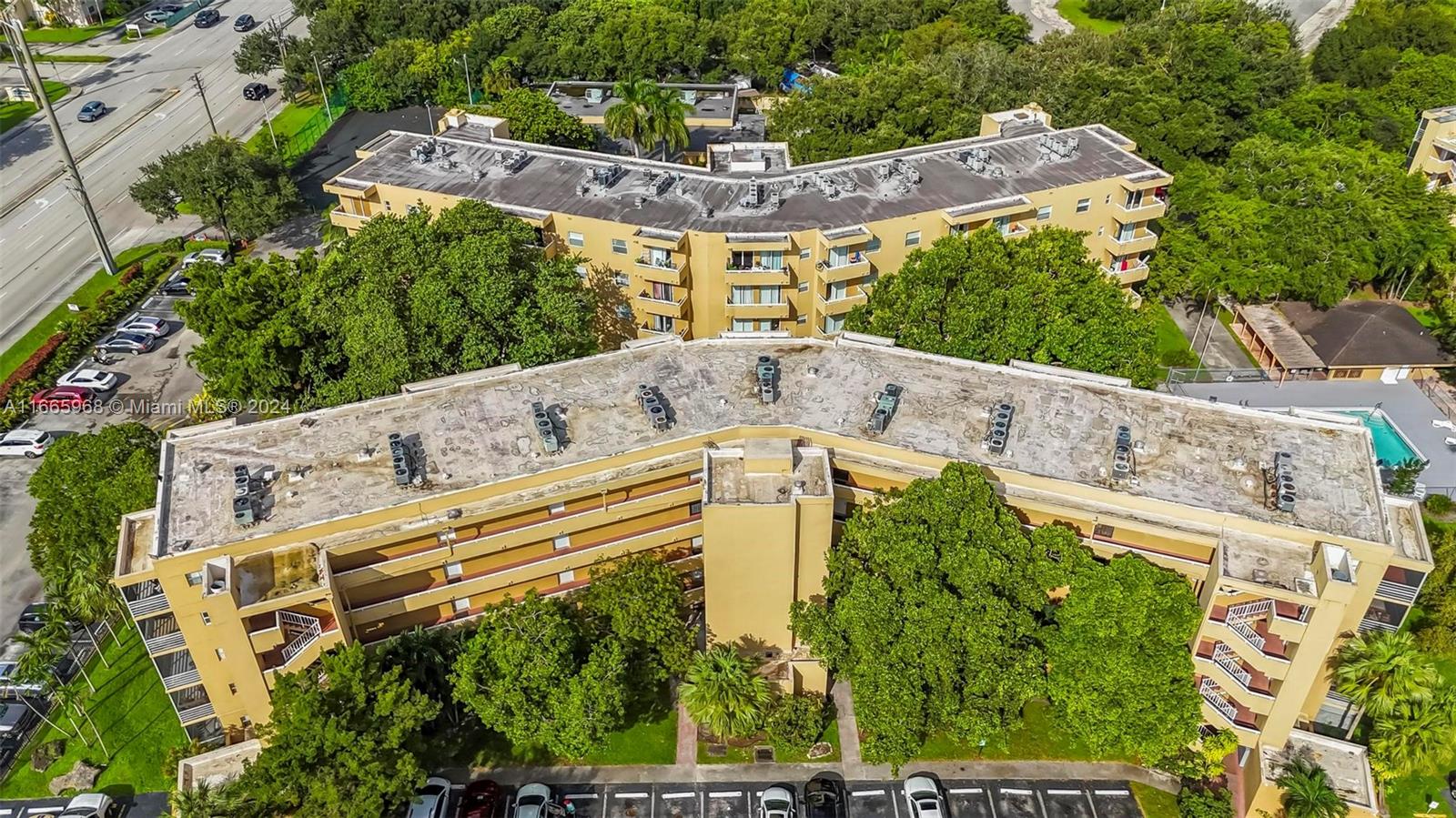 4111 Stirling Road, Unit 304 Fort Lauderdale, FL 33314 - Photo 18 of 22 a view of a swimming pool with a yard