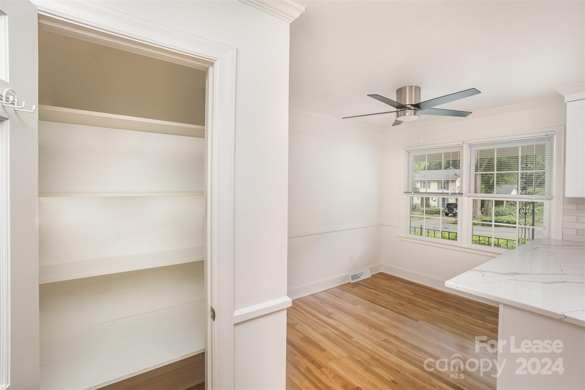 926 Shady Bluff Drive Charlotte, NC 28211 - Photo 12 of 44 a view of a room with a window and wooden floor