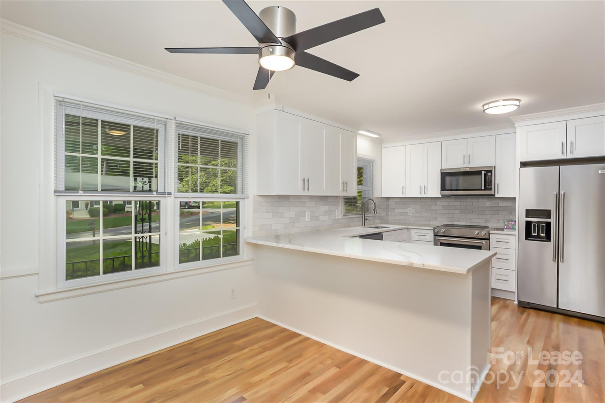 926 Shady Bluff Drive Charlotte, NC 28211 - Photo 14 of 44 a kitchen with stainless steel appliances granite countertop a stove and a refrigerator