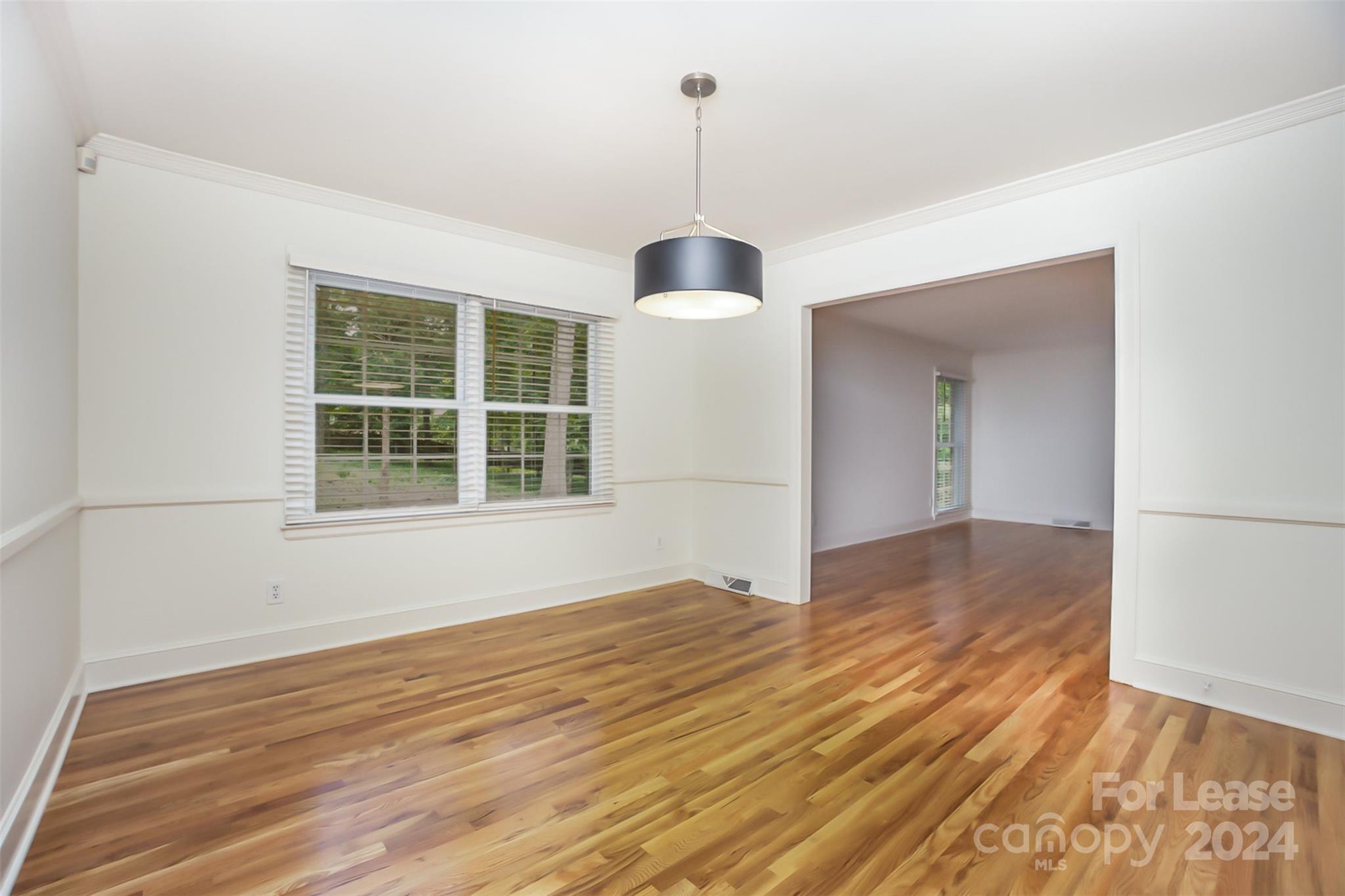 926 Shady Bluff Drive Charlotte, NC 28211 - Photo 15 of 44 a view of empty room with wooden floor and fan