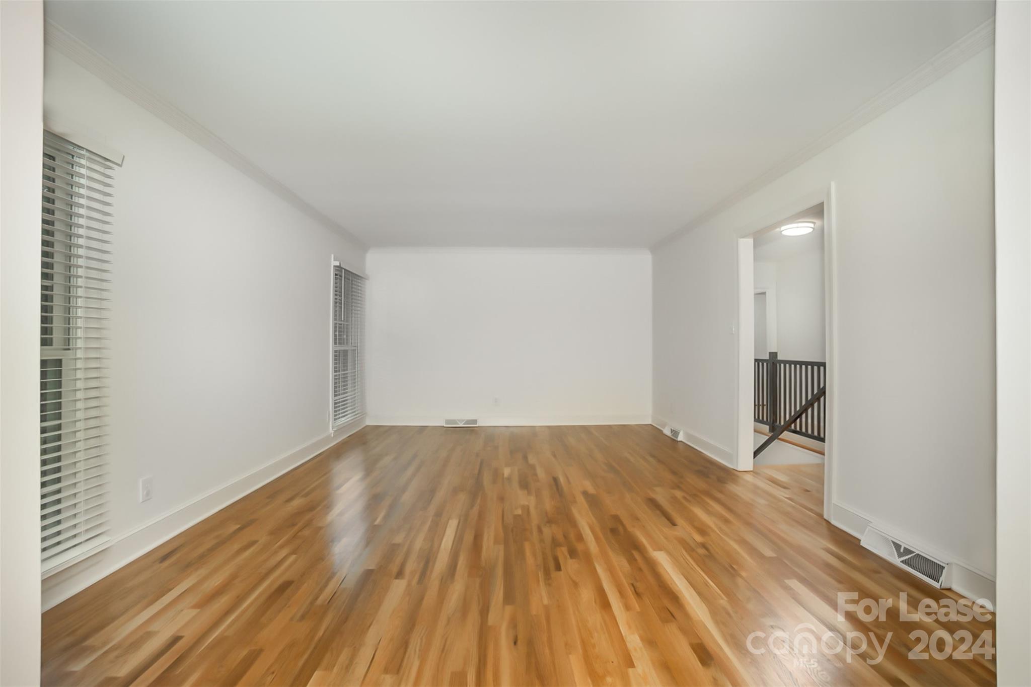 926 Shady Bluff Drive Charlotte, NC 28211 - Photo 16 of 44 a view of empty room with wooden floor and fan