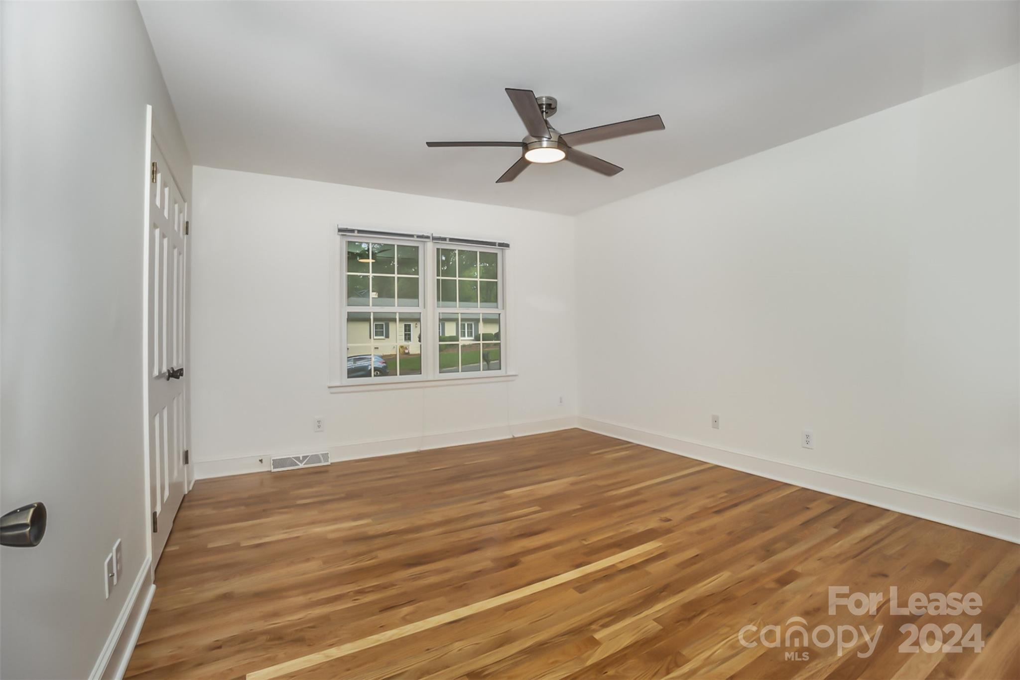 926 Shady Bluff Drive Charlotte, NC 28211 - Photo 18 of 44 a view of an empty room with a window