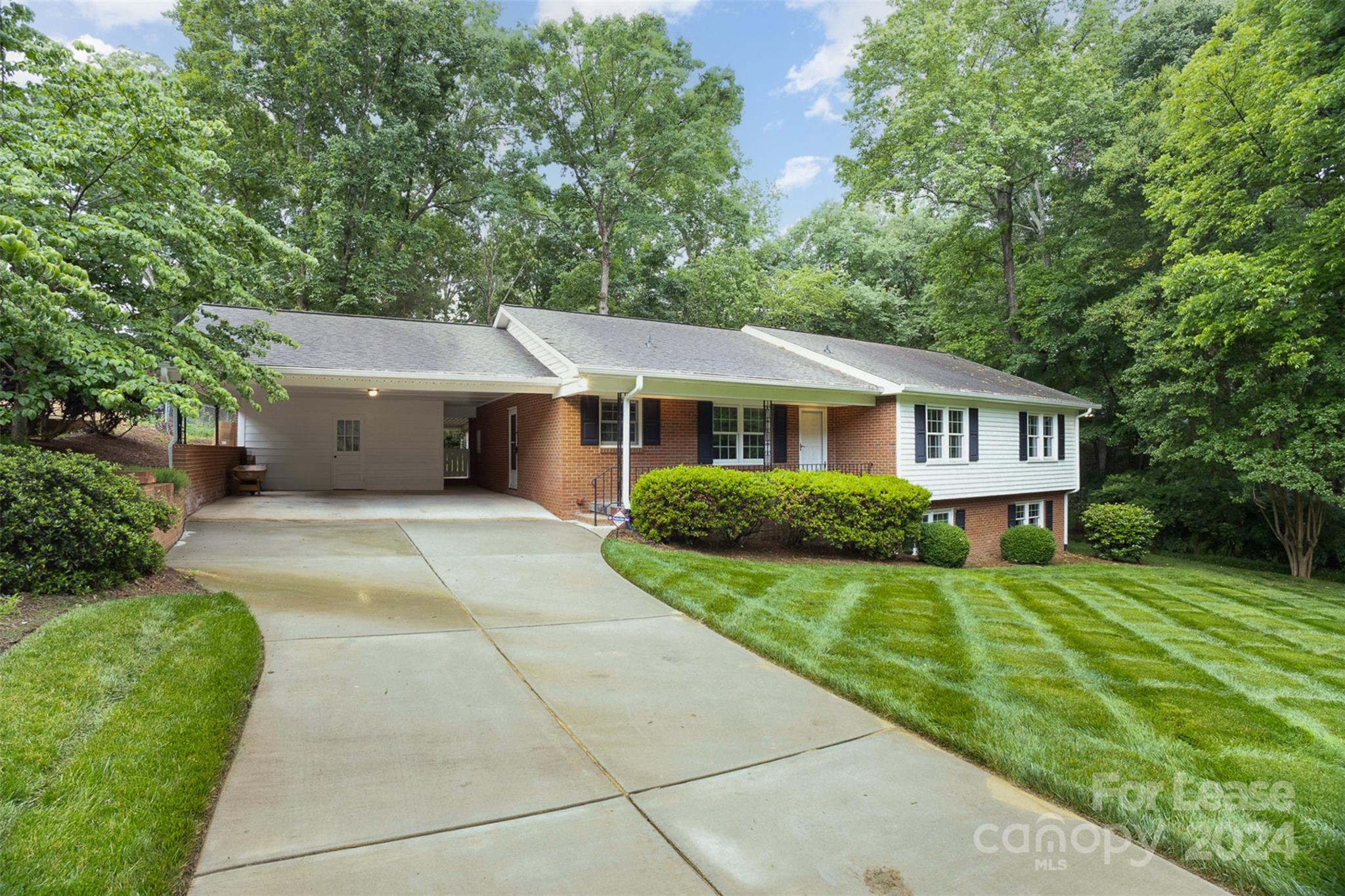 926 Shady Bluff Drive Charlotte, NC 28211 - Photo 2 of 44 a front view of a house with a yard