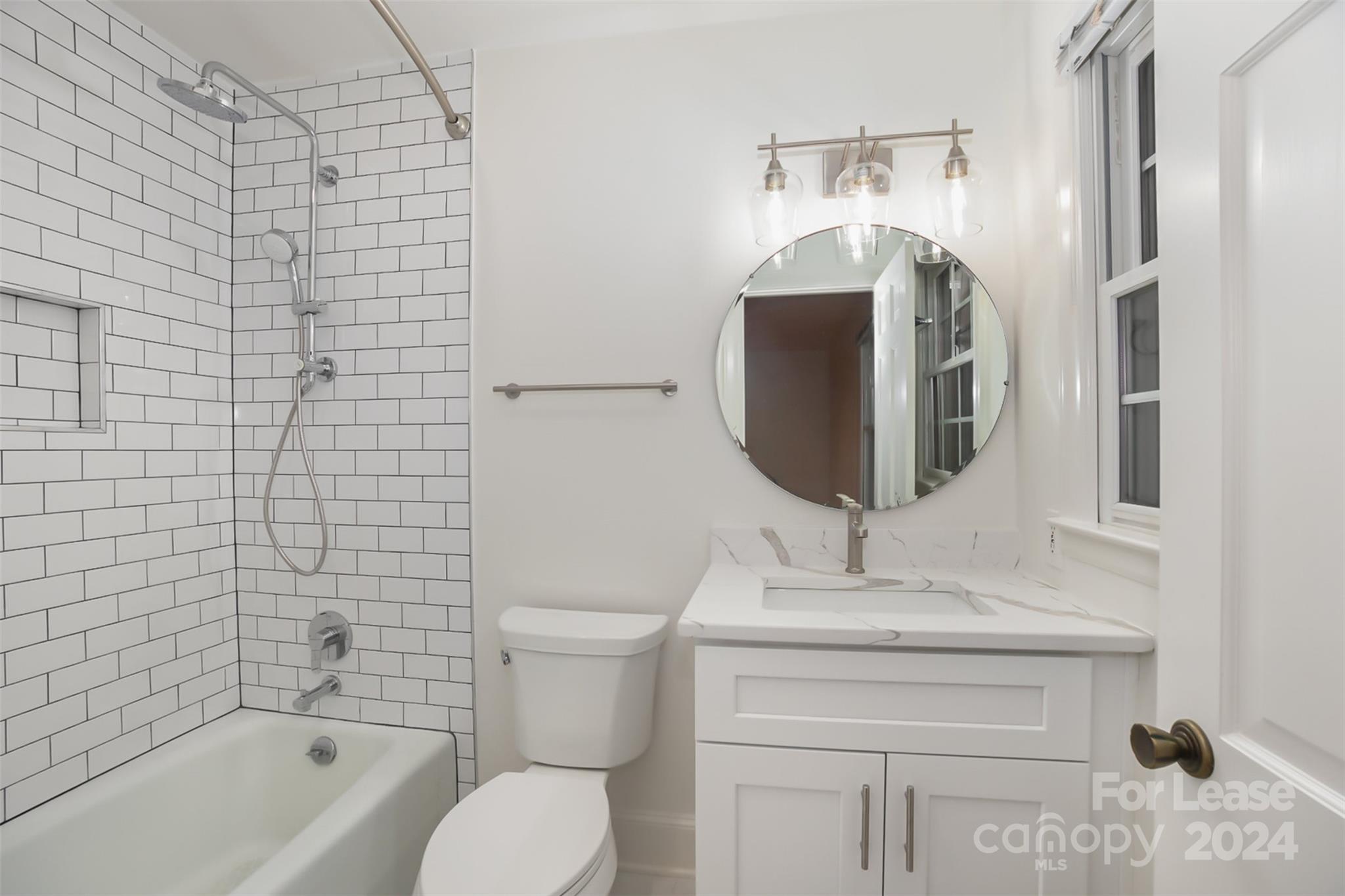 926 Shady Bluff Drive Charlotte, NC 28211 - Photo 22 of 44 a bathroom with a toilet sink and mirror