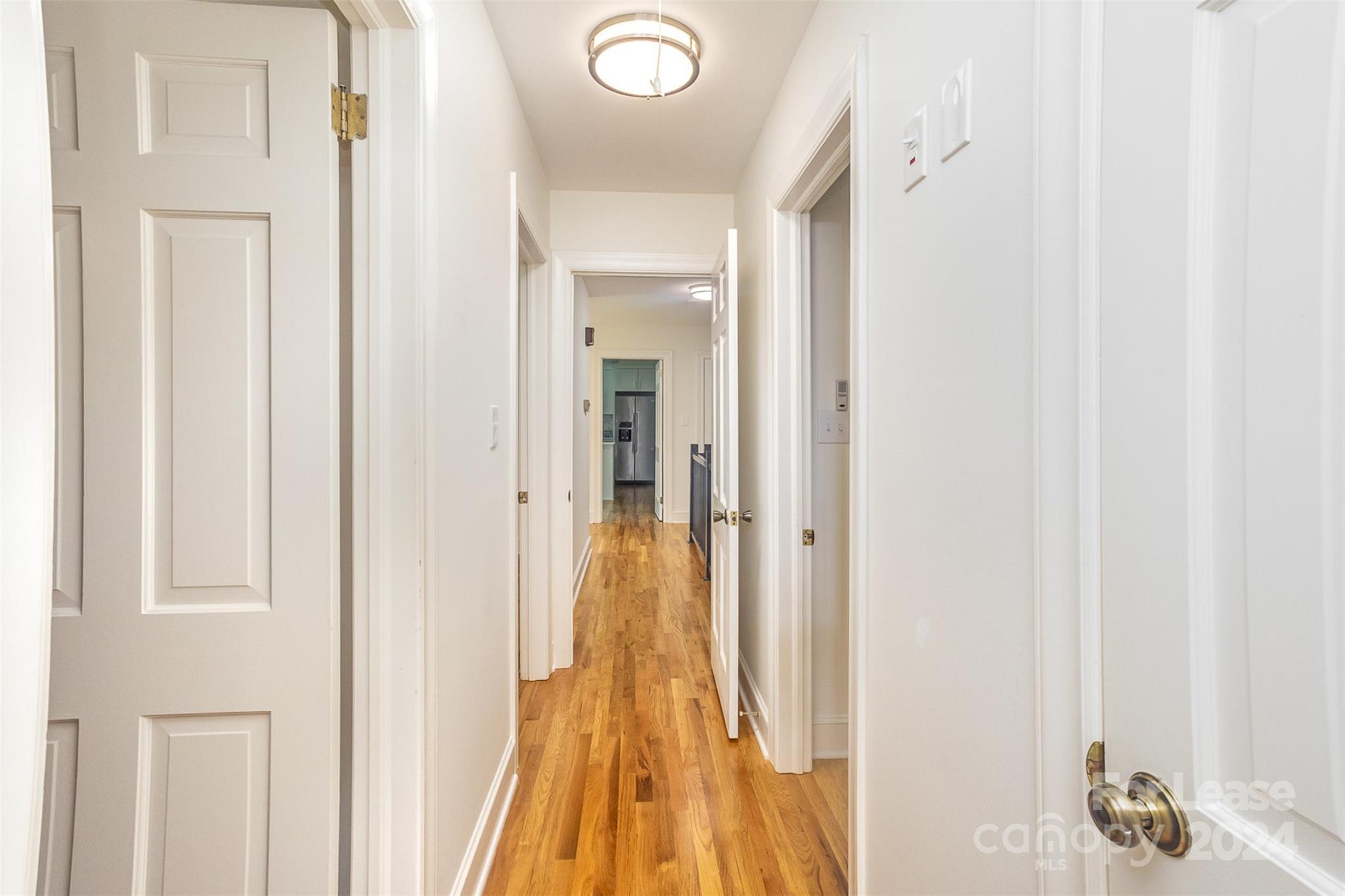 926 Shady Bluff Drive Charlotte, NC 28211 - Photo 23 of 44 a view of a hallway with wooden floor and closet