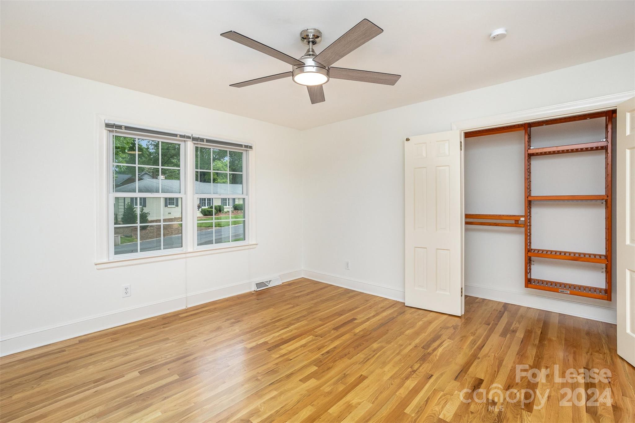 926 Shady Bluff Drive Charlotte, NC 28211 - Photo 24 of 44 an empty room with closet and ceiling fan