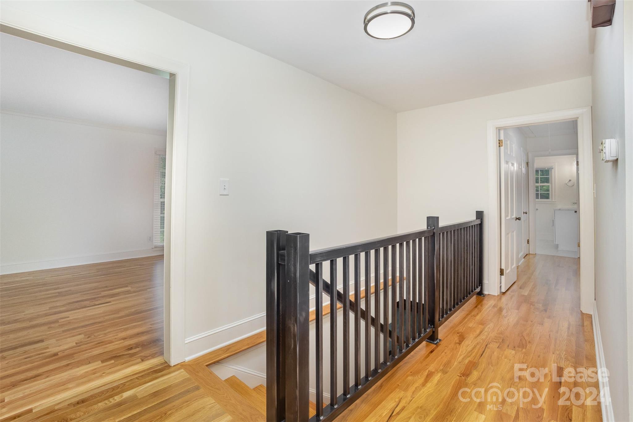 926 Shady Bluff Drive Charlotte, NC 28211 - Photo 7 of 44 a view of a hallway with wooden floor