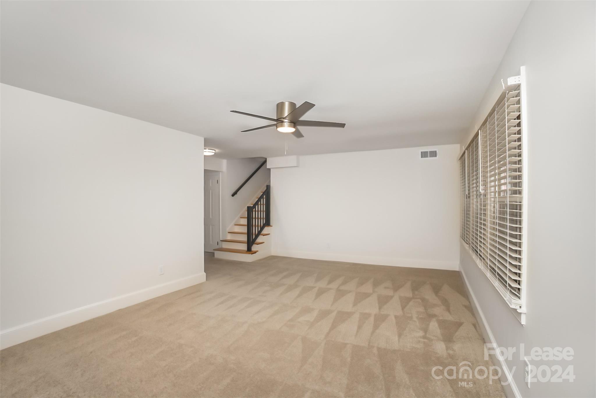 926 Shady Bluff Drive Charlotte, NC 28211 - Photo 9 of 44 a view of an empty room with a window