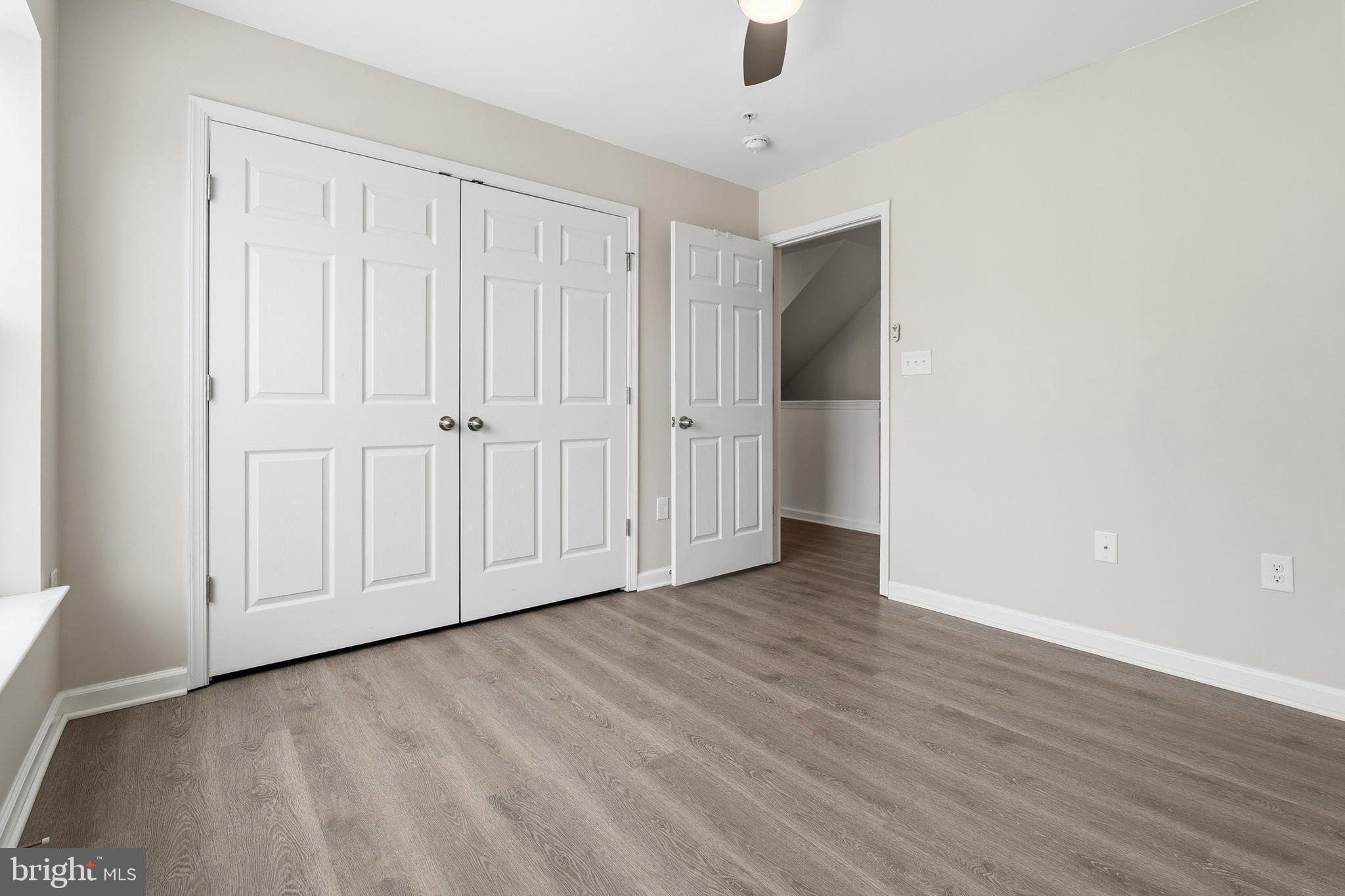 5902 Forum Square Frederick, MD 21703 - Photo 13 of 28 a view of an empty room with wooden floor