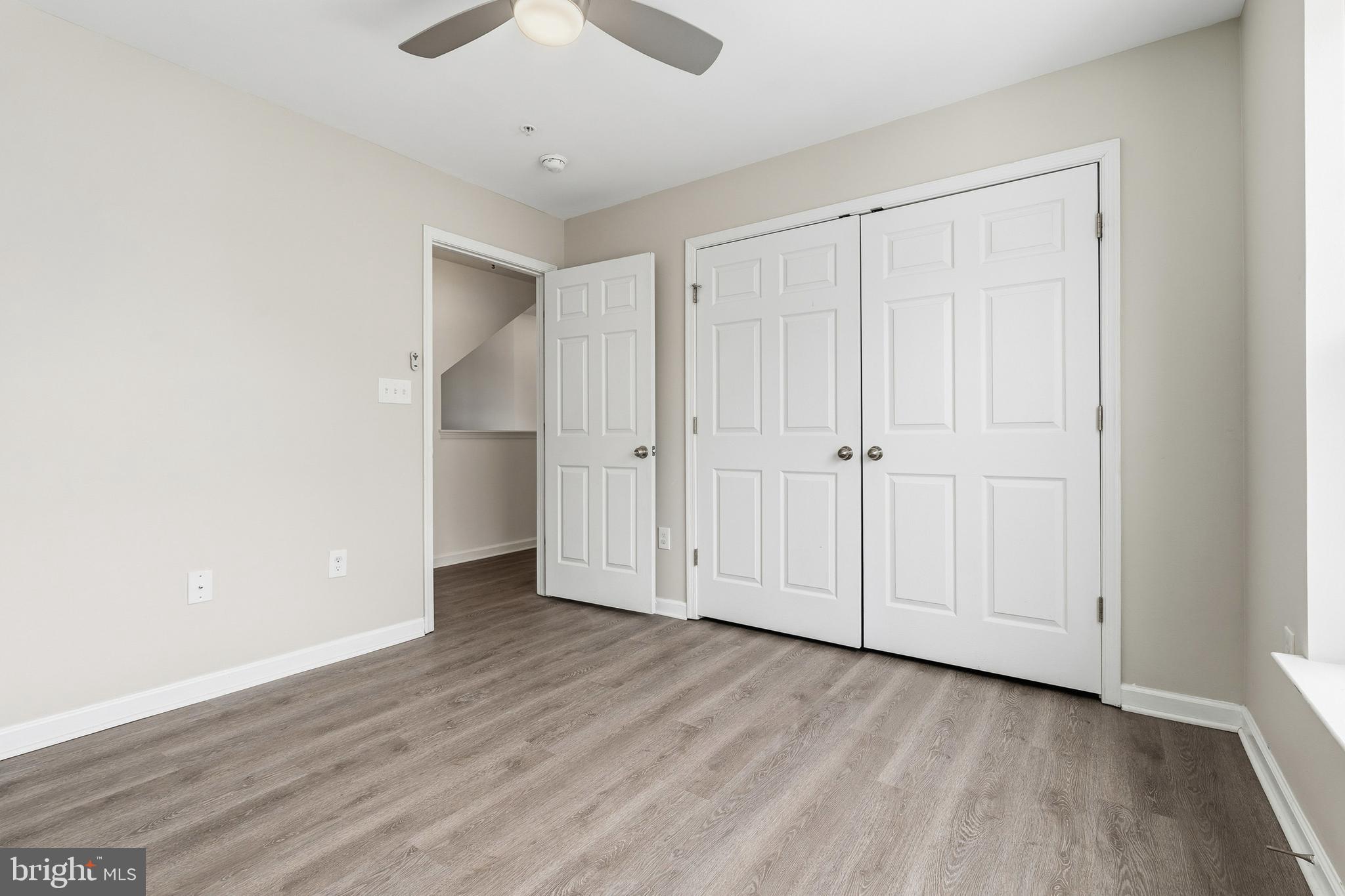 5902 Forum Square Frederick, MD 21703 - Photo 16 of 28 an empty room with wooden floor