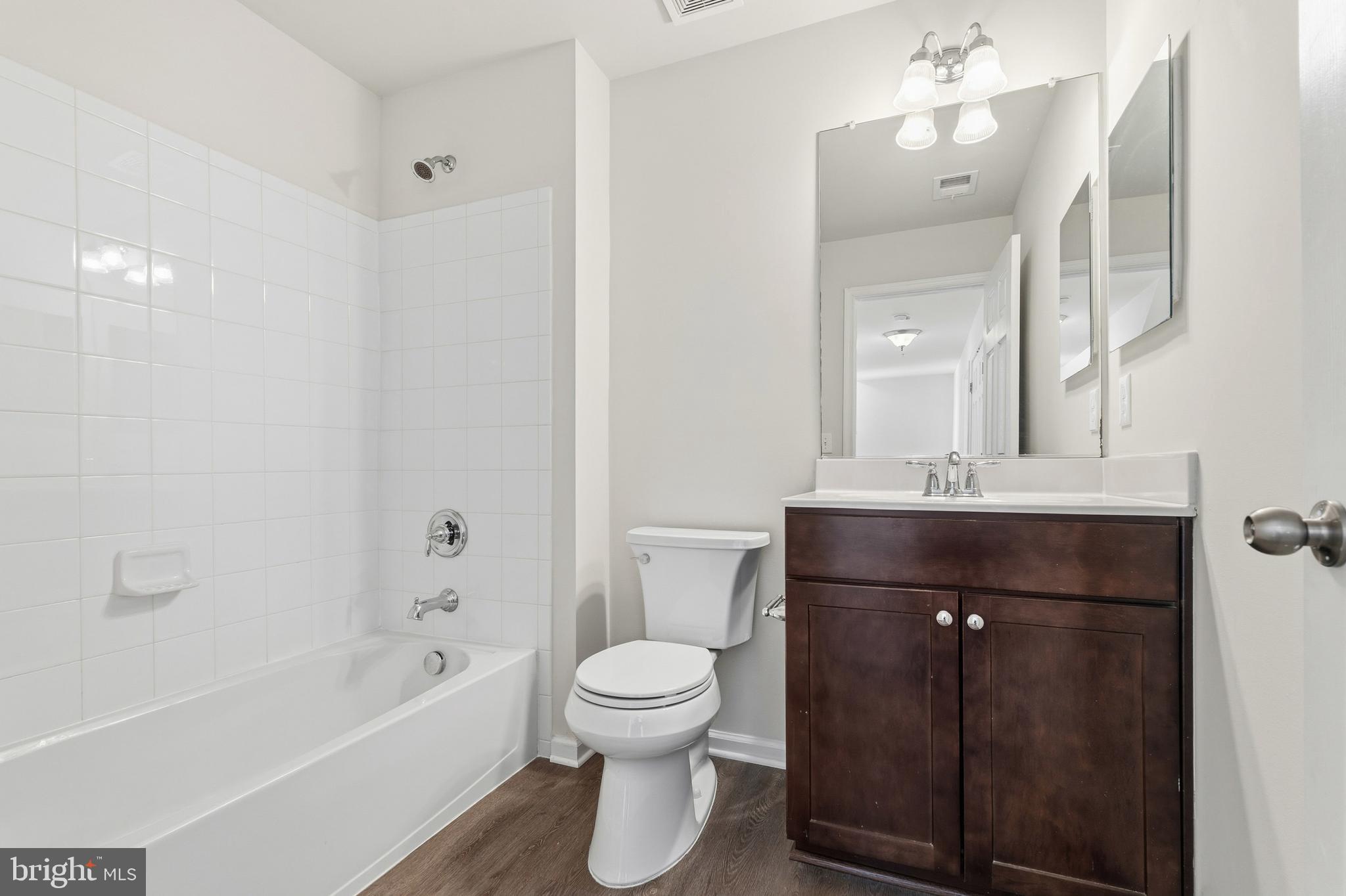 5902 Forum Square Frederick, MD 21703 - Photo 17 of 28 a bathroom with a toilet a sink and a bathtub