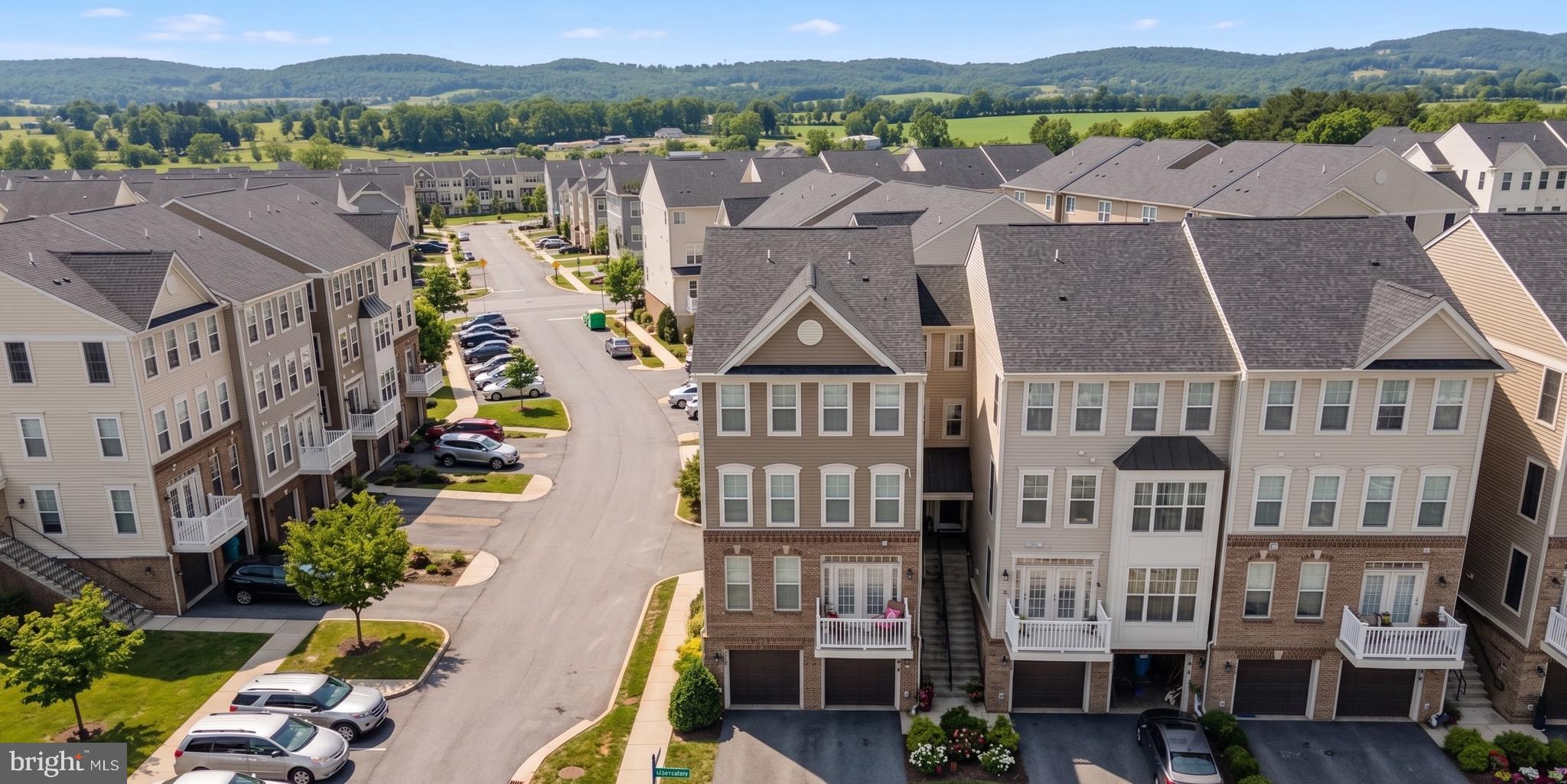 5902 Forum Square Frederick, MD 21703 - Photo 2 of 28 an aerial view of residential houses with outdoor space and parking
