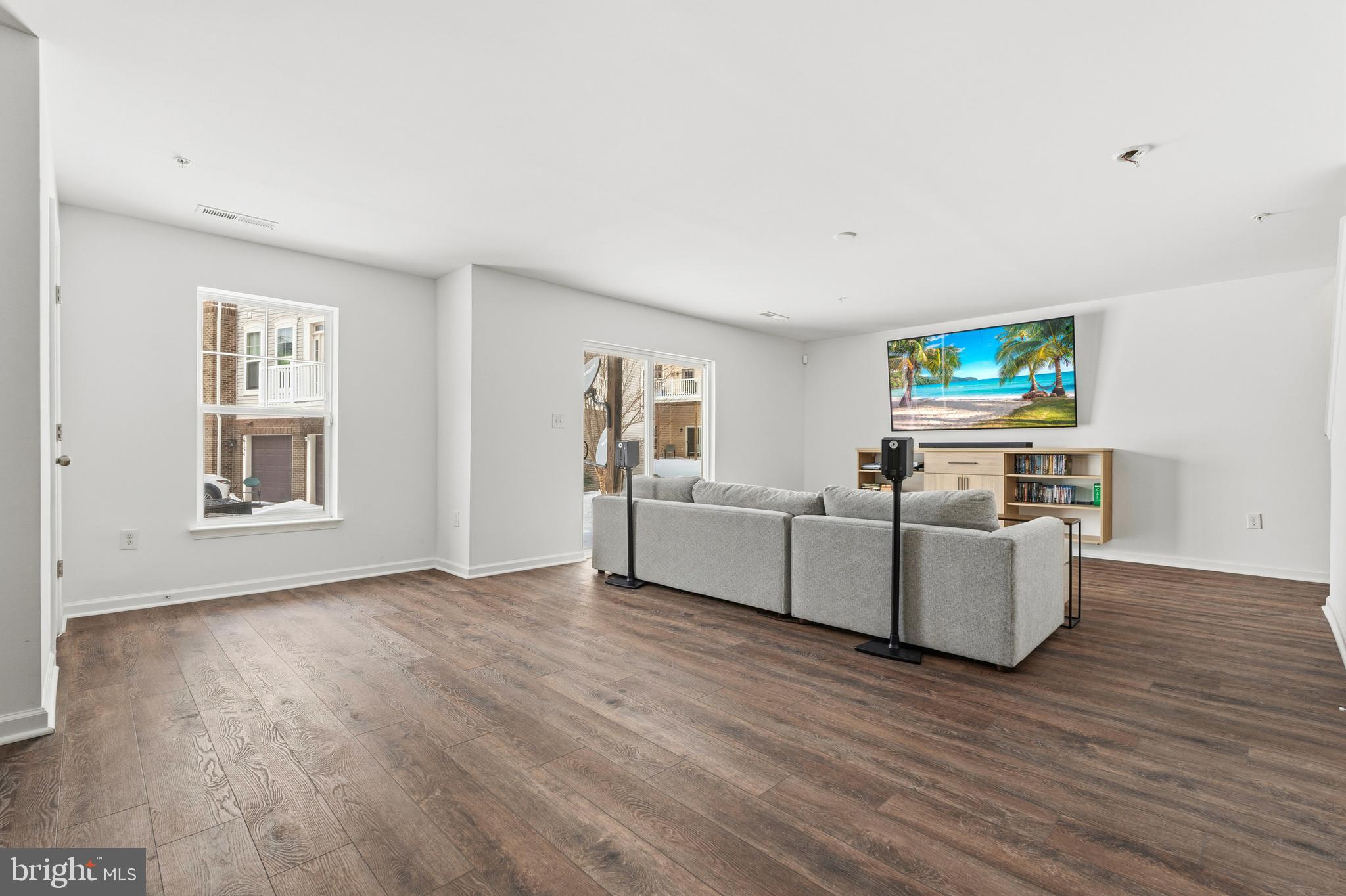 5902 Forum Square Frederick, MD 21703 - Photo 24 of 28 a living room with furniture and a flat screen tv